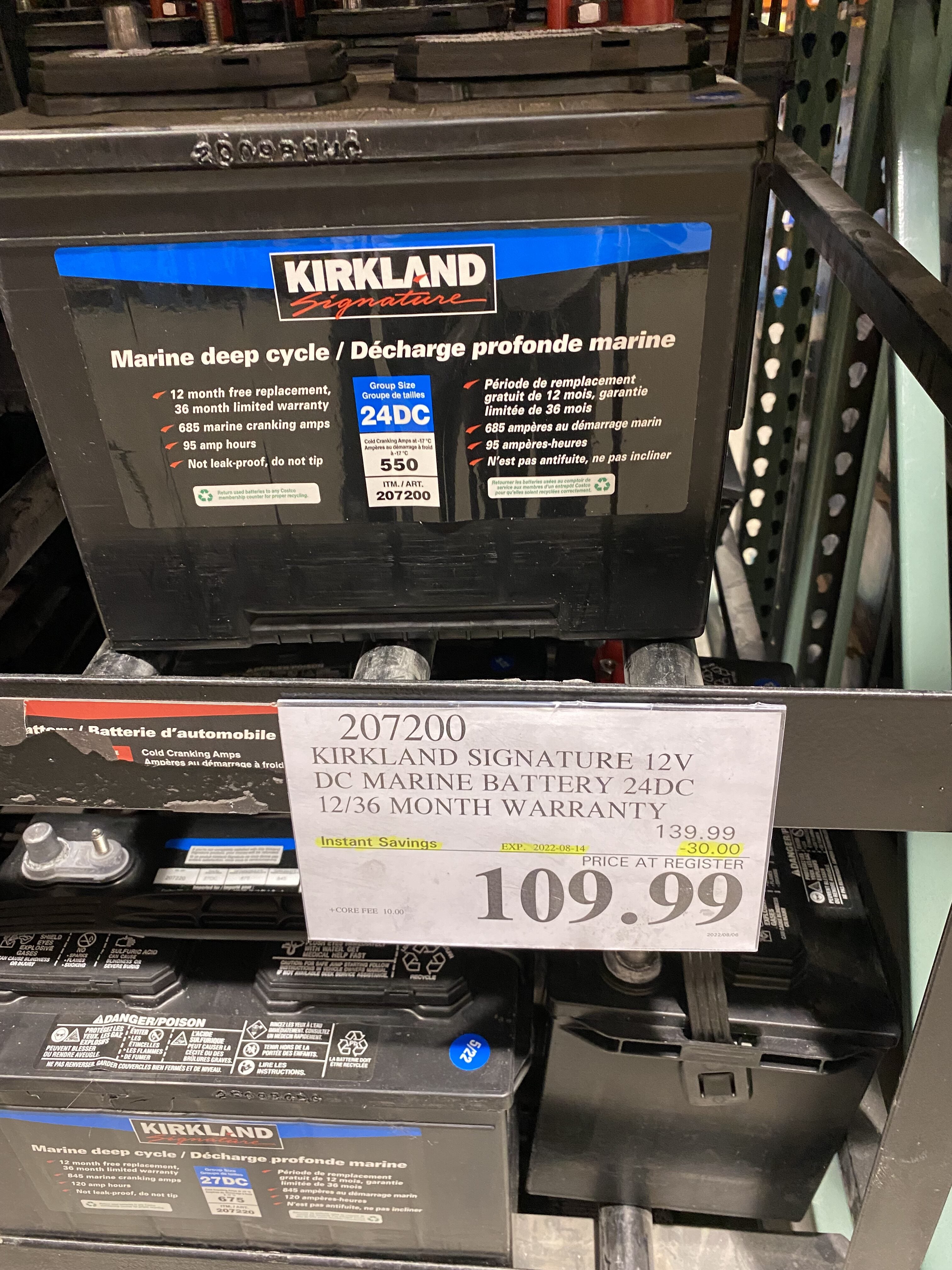 Photo of Kirkland car batteries on shelves at Costco Wholesale warehouse  store